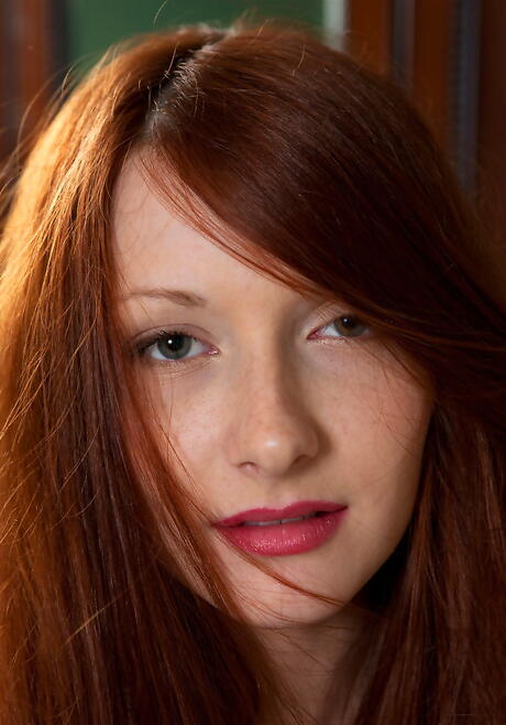 Sexy redhead young Jodie A revealing big tits and bald pussy 