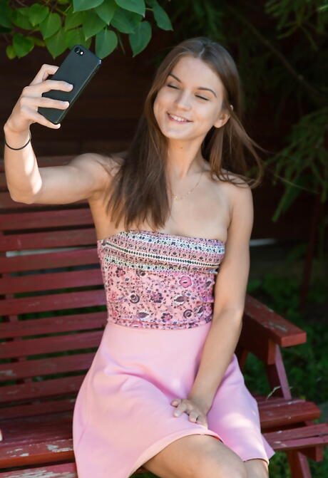 Gracile russian brunette youthful Evelina Darling uncovers tiny tits and masturbates outdoor